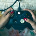 person-holding-microsoft-xbox-one-controller-1666759